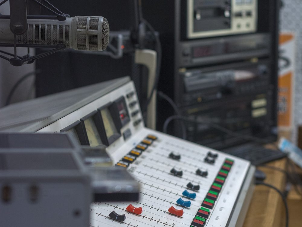 Radio broadcast studio mixing desk and microphone
